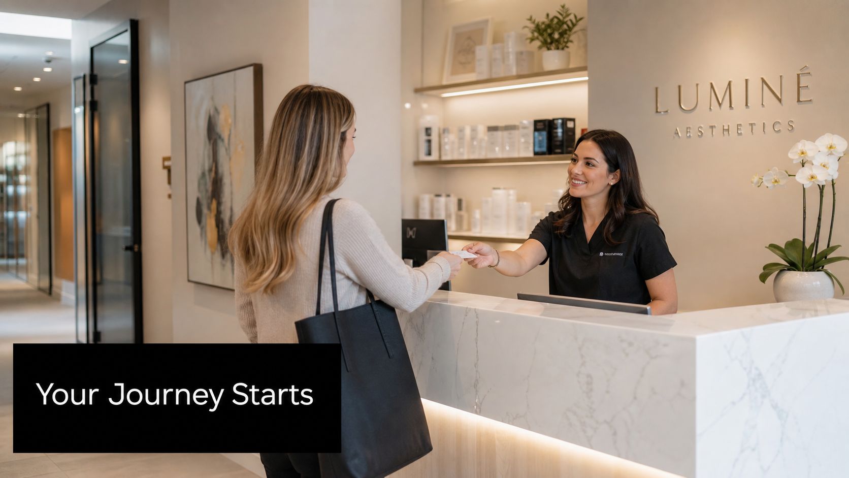 A friendly receptionist hands a consultation card to a client at the luxury Lumine Aesthetics clinic desk.